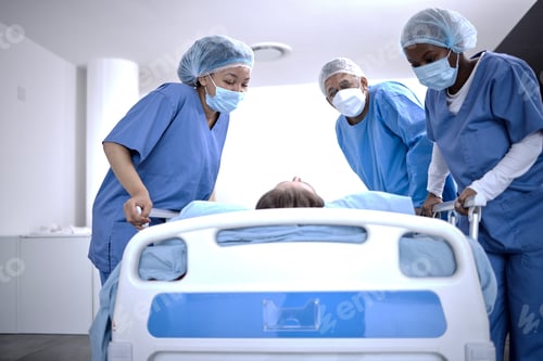 Preview: Covid, surgery and doctors with a patient for a check, healthcare support and consultation. Hospita