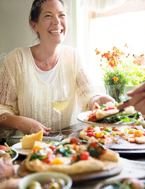 Preview: Woman enjoying a pizza dinner