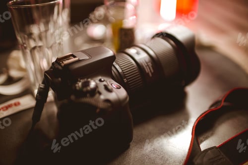 Preview: Shallow focus of a modern digital camera on a cafe table