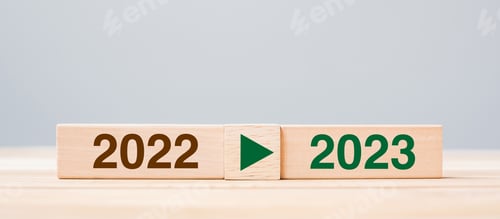 Preview: 2023 and 2022 wooden block on table background.