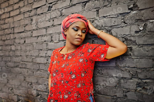Preview: Stylish african woman in red shirt and hat