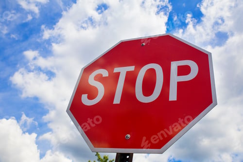 Preview: Red stop sign on the street, roadside traffic for stopping.