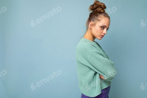 Preview: Woman in Green Sweater with Moody Expression