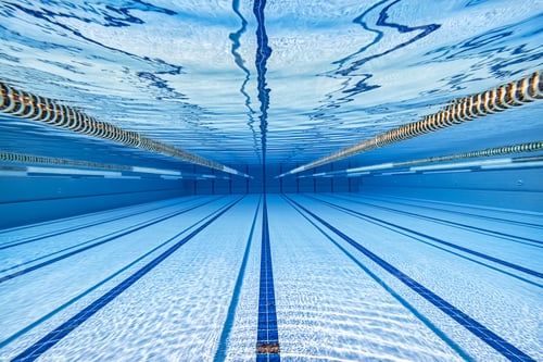 Preview: Olympic Swimming pool under water background.