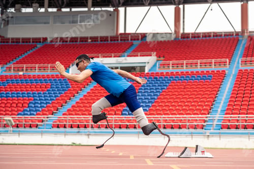 Preview: Asian para-athletes disabled with prosthetic blades running at stadium.
