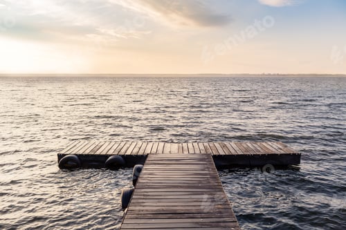Preview: Peaceful empty wooden bridge in the morning sun