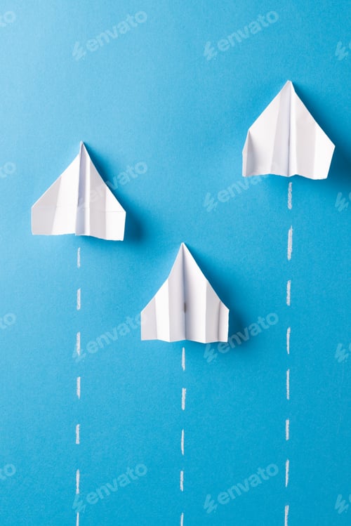 Preview: Image of three white paper plains and lines on blue background