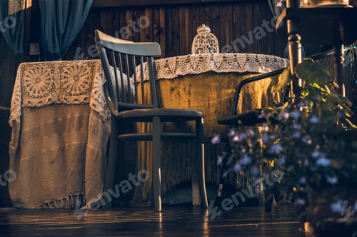 Preview: An empty brown chair next to a table.