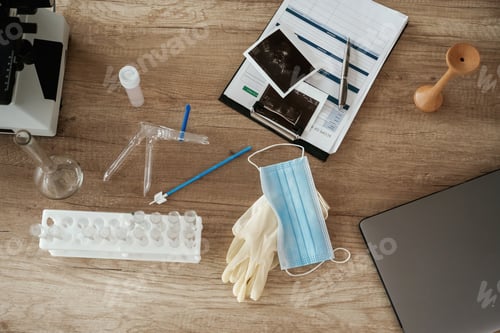 Preview: Microscope and laptop. Doctor's equipment, objects on the table