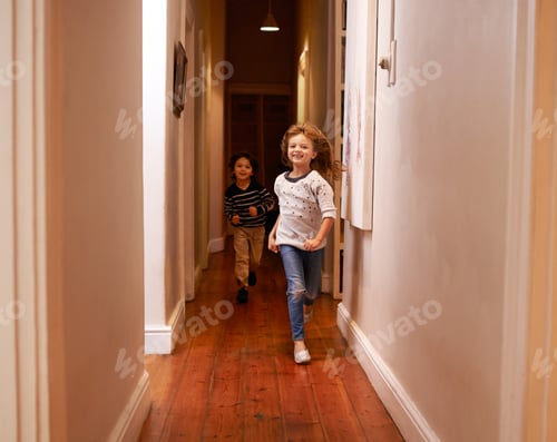 Preview: Dont run in the house. Shot of two children running down a hallway.