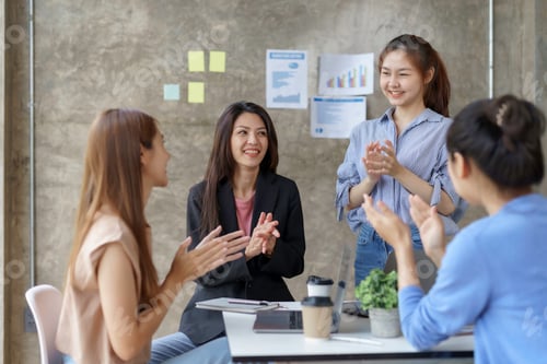 Preview: Group of young Asian business woman are meeting to present a new roadmap in product design