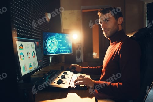 Preview: Male Videographer Edits and Cuts Footage and Sound on His Personal Computer