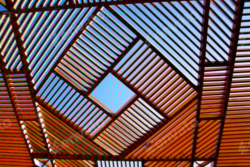 Preview: Abstract view of a wooden slatted roof with a geometric design