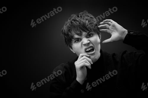 Preview: crazy young man with awesome hairdo grimacing