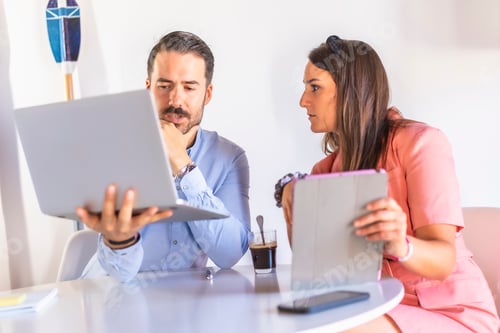 Preview: Professional Man and Woman Working with Technology