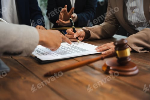 Preview: justice and law concept. team judge in a courtroom the gavel, working with digital tablet computer