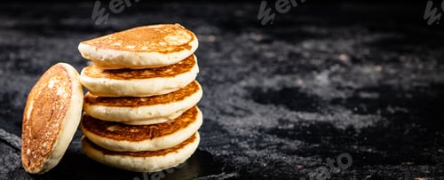 Preview: Ready made homemade pancakes on a stone board.