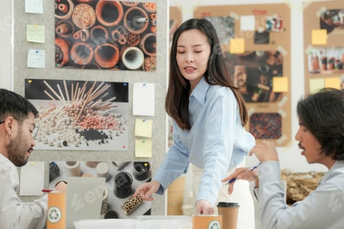 Preview: Creative team presenting eco friendly packaging ideas in a modern office.