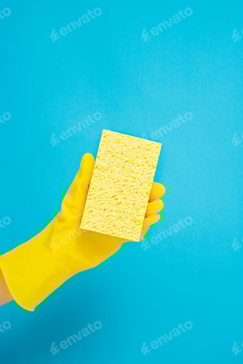 Preview: Yellow Sponge and Glove Against a Blue Background