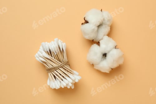 Preview: Cotton swabs and cotton on beige background