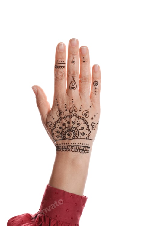Preview: Woman with beautiful henna tattoo on hand against white background, closeup. Traditional mehndi