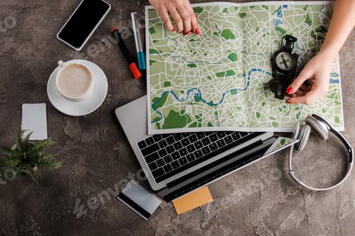 Preview: top view of woman near map, compass, credit cards and gadgets, e-commerce concept, e-commerce