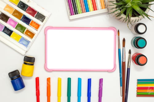 Preview: Children's pink digital tablet with a blank screen on a white ta