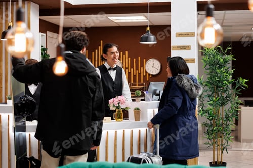 Preview: Couple with winter clothes at front desk