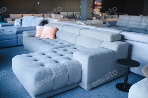 Preview: Modern sofa displaying in furniture showroom interior