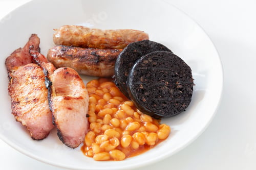 Preview: Cumberland sausages, bacon, baked beans and black pudding in a white bowl