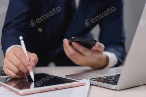 Preview: A man is writing on a tablet with a pen