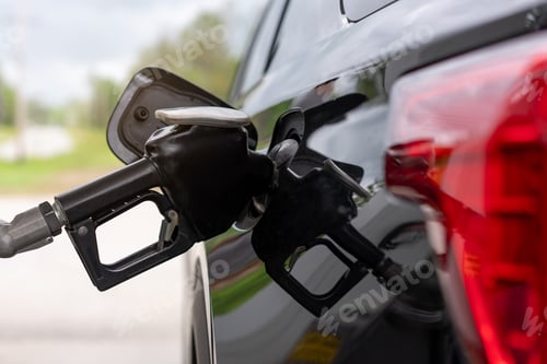 Preview: Refueling a car with gasoline at a petrol station.