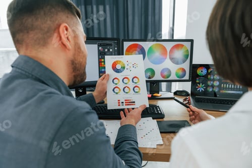 Preview: Choosing right colors. Two designers working together in the office