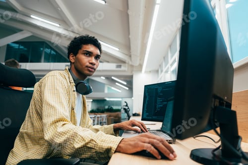 Preview: young programmers working on a new project for a start up business.