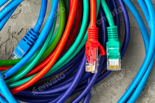 Preview: Colored network cable patch-cord on gray textured background