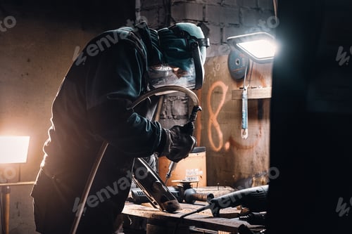 Preview: Busy man is working on metal factory