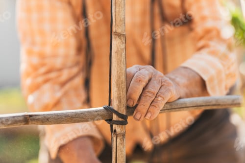 Preview: detailed view of hands of elderly person at work. Selective focus.