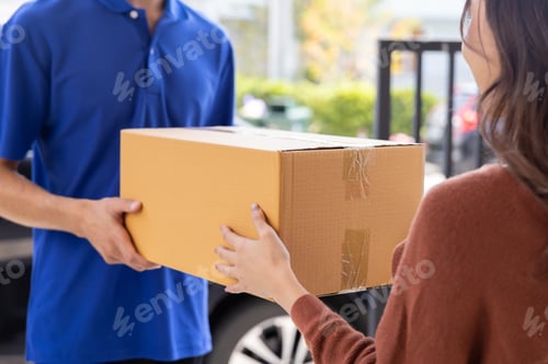 Preview: Asian Woman Received a Caton Parcel Box From a Delivery Man