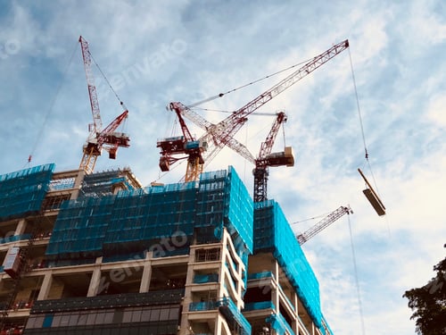 Preview: Cranes and building construction heavy equipments on site.