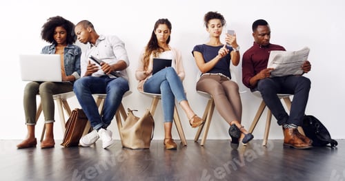 Preview: Shot of a group of diverse businesspeople waiting in line for an interview