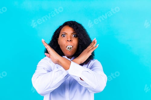 Preview: afro woman winning with addicted nicotine problems, stop smoking studio blue background
