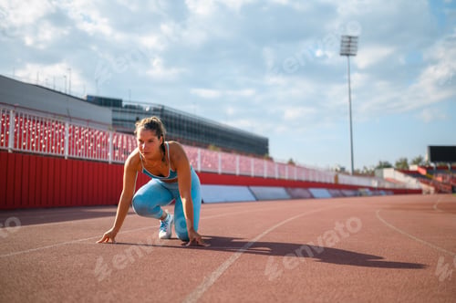 Preview: Portrait of a young female racer preparing for a race in a sports arena