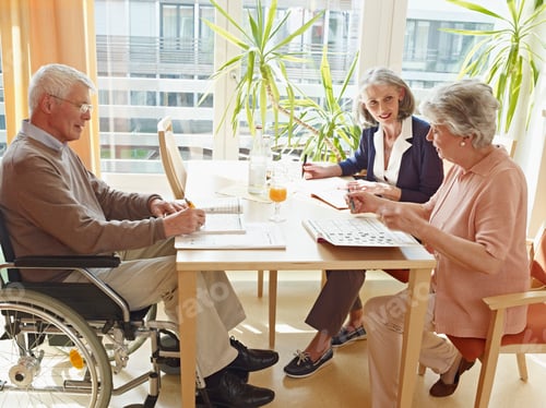 Preview: Germany, Cologne, Men on wheelchair with women sitting in nursing home