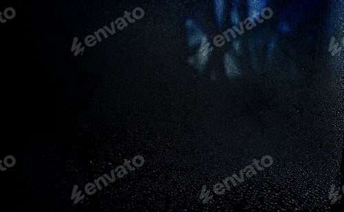 Preview: Abstract wet glass bokeh background on black background
