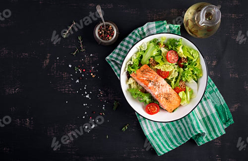 Preview: Baked salmon fillet with fresh vegetables salad. Top view, overhead