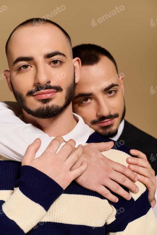 Preview: Stylish twin brothers enjoying a moment together while dressed in fashionable attire