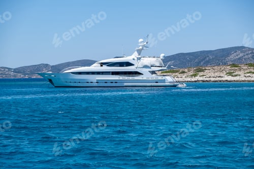 Preview: Luxury yacht anchored in emerald water. Panteronisi islet, between Paros Antiparos Cyclades Greece..