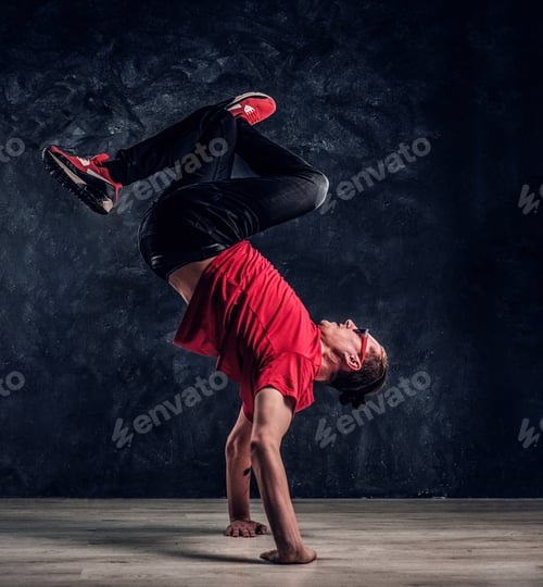Preview: Hip-hop style dancer performs breakdance acrobatic elements.
