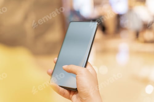 Vista previa: Shot of a hand, holding a mobile phone for mockups