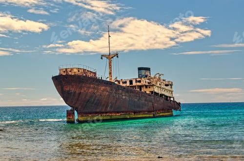 Preview: Telamon shipwreck on the sea under a blue sky and sunlight in Lanzarote Island, Spain